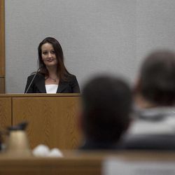 Witness Gypsy Willis looks to defendant Martin MacNeill while on the witness stand during a preliminary hearing at the Fourth District Court in Provo Wednesday, Oct. 10, 2012. 