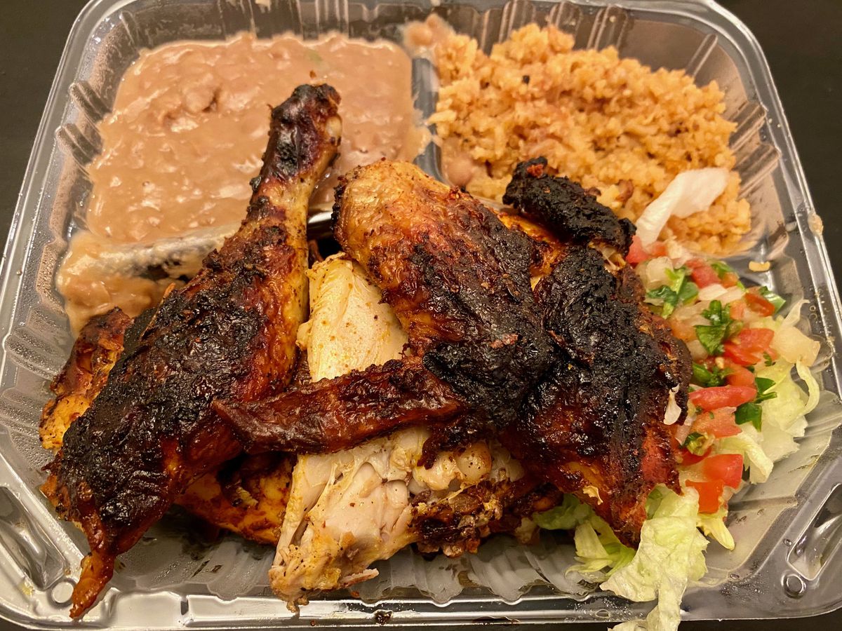 La Selva’s half-chicken plate, with rice and beans, in a to-go container