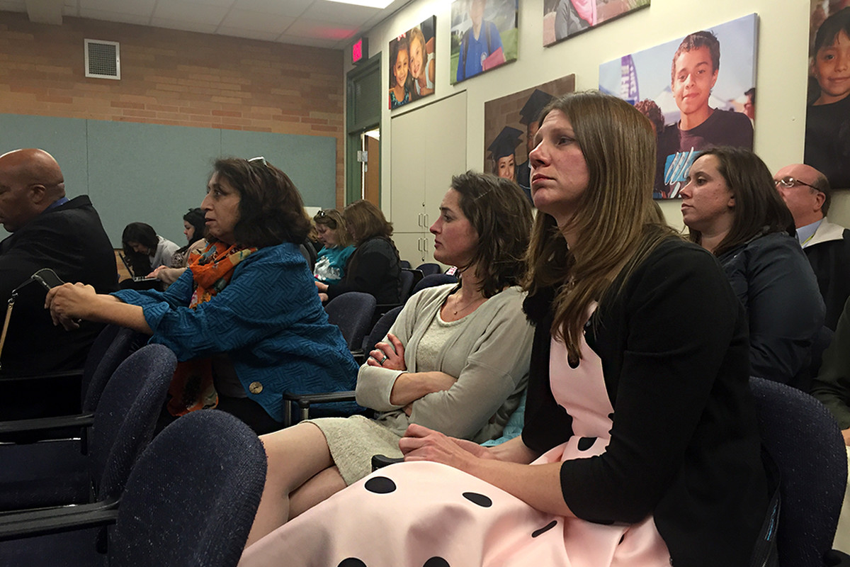 Boston K8 Principal Ruth Badivia, left, with Crawford Elementary School Assistant Principal Jennifer Buster and Jenny Passchier listen to the Aurora school board before it voted on their schools redesign plans.