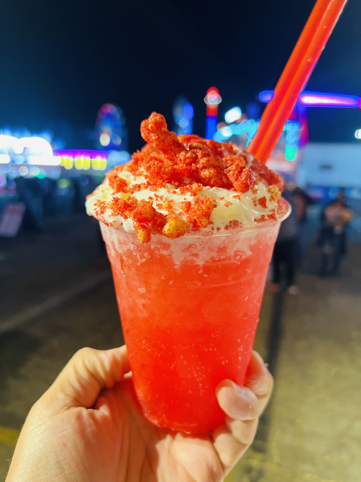 bright red Hot Cheetos-infused float topped with whipped cream and crunchy Hot Cheetos.