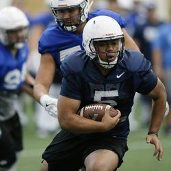 Brigham Young Cougars RB Ula Tolutau (5) runs during BYU football alumni day practice in Provo on Friday, March 31, 2017.