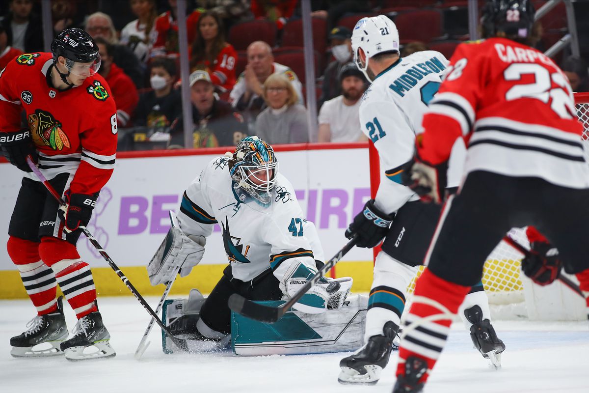 James Reimer makes a save during a game between the Chicago Blackhawks and the San Jose Sharks on November 28, 2021 at the United Center in Chicago, IL.