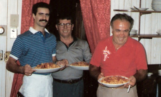 Joe Pierri (right) serving food in the banquet room of Little Joe’s with his cousins Dominic Pellegrino (left) and Antonio Toccogna (center) | Provided photo