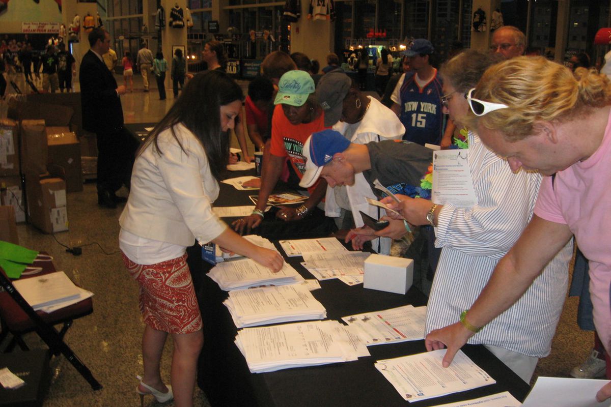 Something every WNBA coach, executive, and player has to like seeing: New York Liberty fans stopping by the season ticket renewal booth at halftime of their exciting win against the Connecticut Sun tonight. <em>Photo by Ray Floriani. </em>

