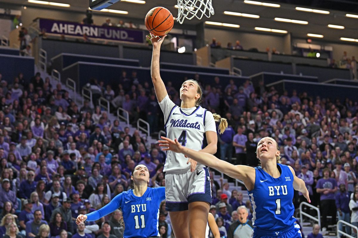 Serena Sundell #4 of the Kansas State Wildcats goes to the basket against Amari Whiting #1 of the BYU Cougars in the second half at Bramlage Coliseum on January 27, 2024 in Manhattan, Kansas