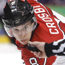 Canada's Sidney Crosby waits for the drop of the puck during a face-off against Slovakia.