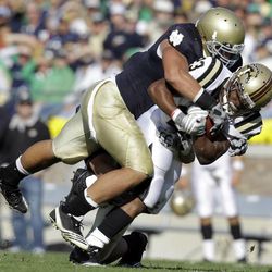 Notre Dame linebacker Manti Te'o, top, tackles Western Michigan running back Aaron Winchester during an NCAA college football game in South Bend, Ind. With T'eo a force at inside linebacker, the Irish's defense got better as the season progressed a year ago.