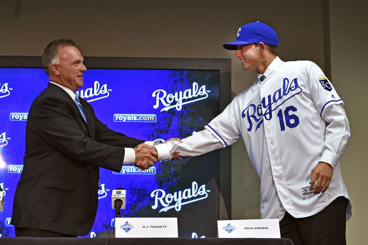 Kansas City Royals 2016 first round draft pick pitcher A.J. Puckett (16) shakes hands with Royals director of scouting Lonnie Goldberg (left) during a media conference prior to a game against the Cleveland Indians at Kauffman Stadium. 