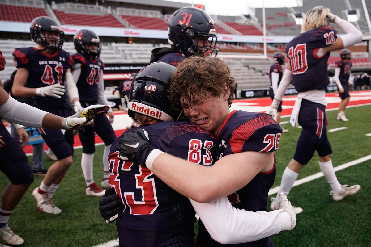 Springville’s Bryan Gordon, right, and Miles Farley get emotional while embracing each other after beating Orem High School in the 5A football state semifinal game at Rice-Eccles Stadium in Salt Lake City on Thursday, Nov. 11, 2021.