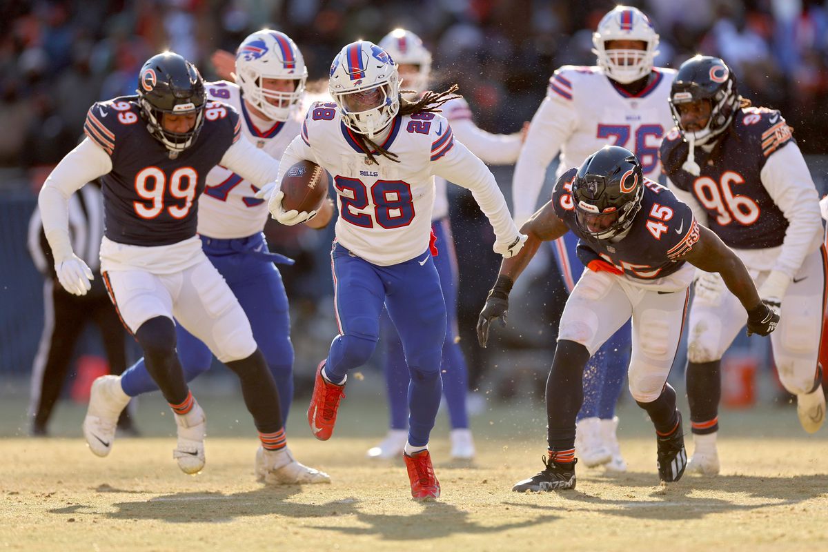 James Cook #28 of the Buffalo Bills rushes for a touchdown against the Chicago Bears during the third quarter of the game at Soldier Field on December 24, 2022 in Chicago, Illinois.