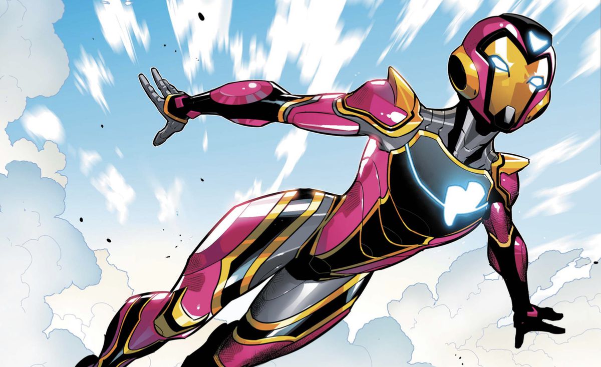 Riri Williams soars through the clouds in her Ironheart suit, with its oblong heart logo in Ironheart #1 (2018).