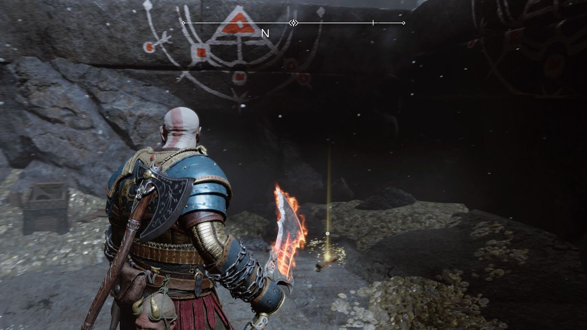Kratos picks up a Lore scroll in God of War Ragnarok