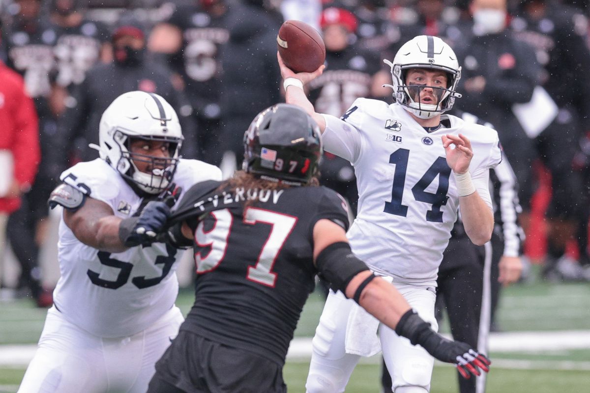 Penn State quarterback Sean Clifford (14) throws the ball as Rutgers Scarlet Knights defensive lineman Mike Tverdov (97) is flicked by offensive lineman Rasheed Walker (53) during the first half at SHI Stadium.