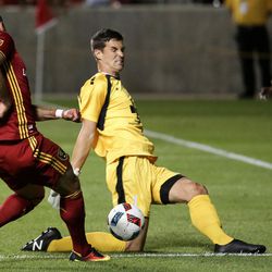 Wilmington goalkeeper John Smits (1) slides in to block a kick by Real Salt Lake forward Yura Movsisyan (14) during a U.S. Open Cup game at Rio Tinto Stadium in Sandy on Tuesday, June 14, 2016.