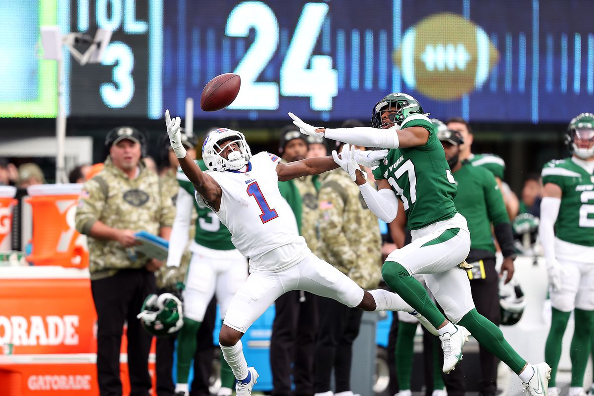 Emmanuel Sanders #1 of the Buffalo Bills reaches for the ball as Bryce Hall #37 of the New York Jets defends in the third quarter at MetLife Stadium on November 14, 2021 in East Rutherford, New Jersey.