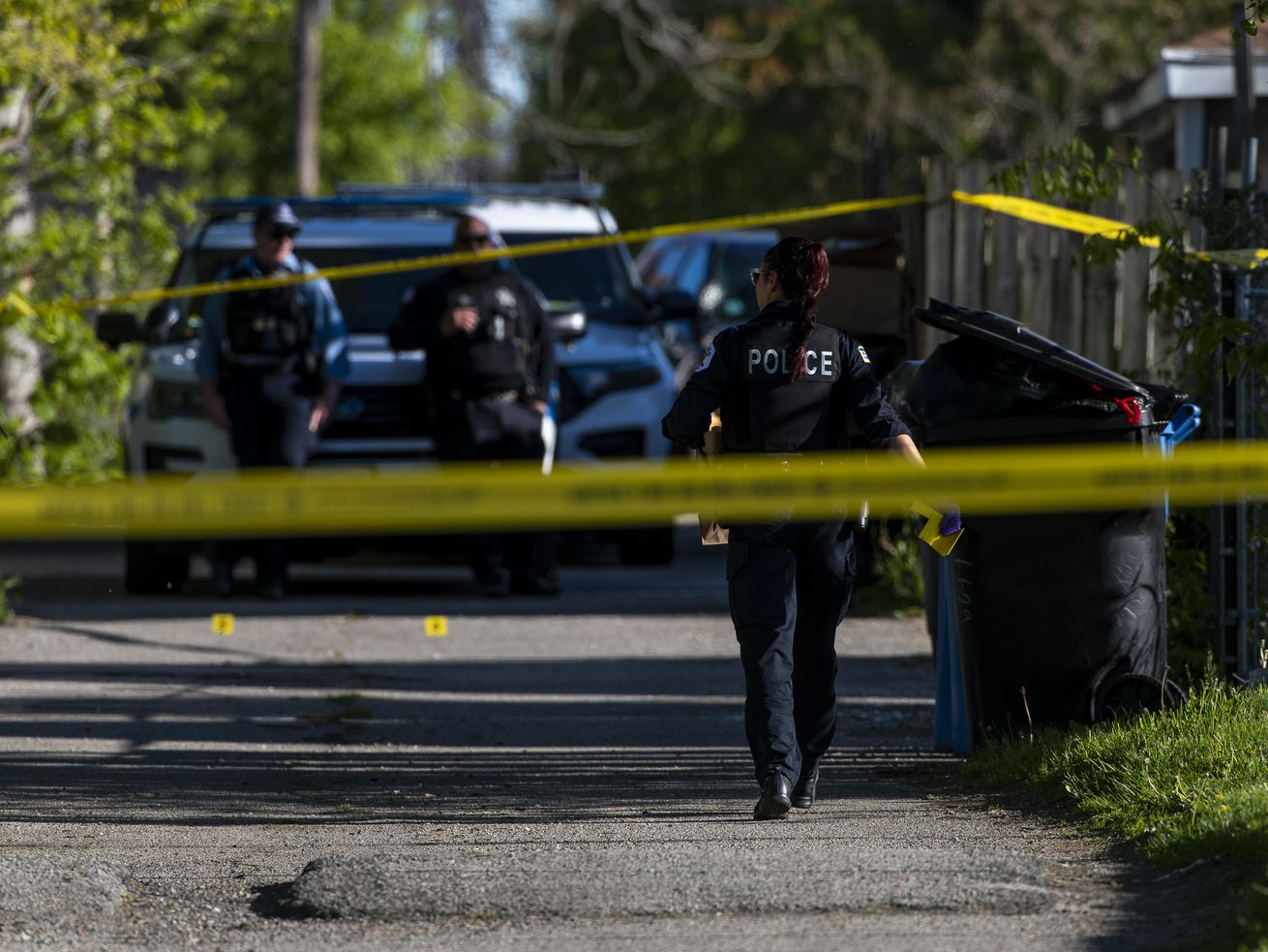 Chicago police work the scene where a 15-year-old boy was critically wounded in a shooting in an alleyway near the 6600 block of South May Avenue in the Englewood neighborhood on May 12.