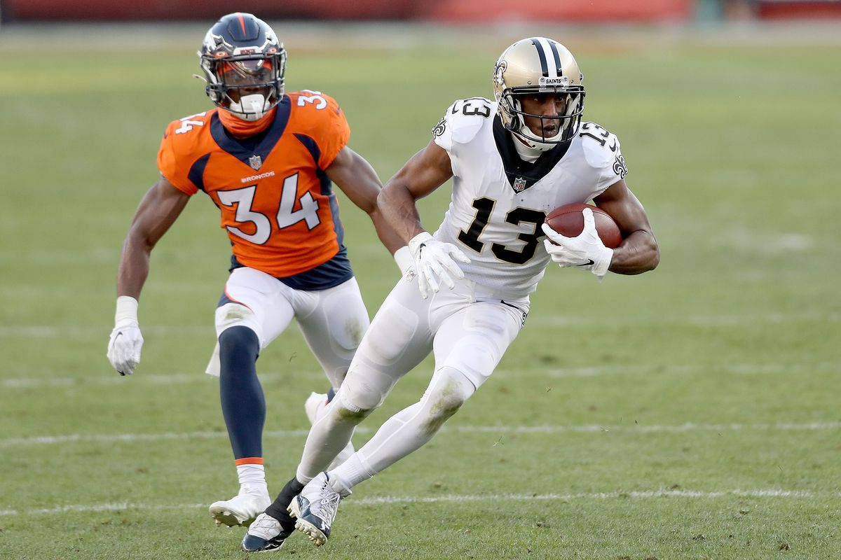 Background:&nbsp;DENVER, COLORADO - NOVEMBER 29: Michael Thomas #13 of the New Orleans Saints carries after a reception ahead of defender Essang Bassey #34 of the Denver Broncos during the second quarter of a game at Empower Field At Mile High on November 29, 2020 in Denver, Colorado.