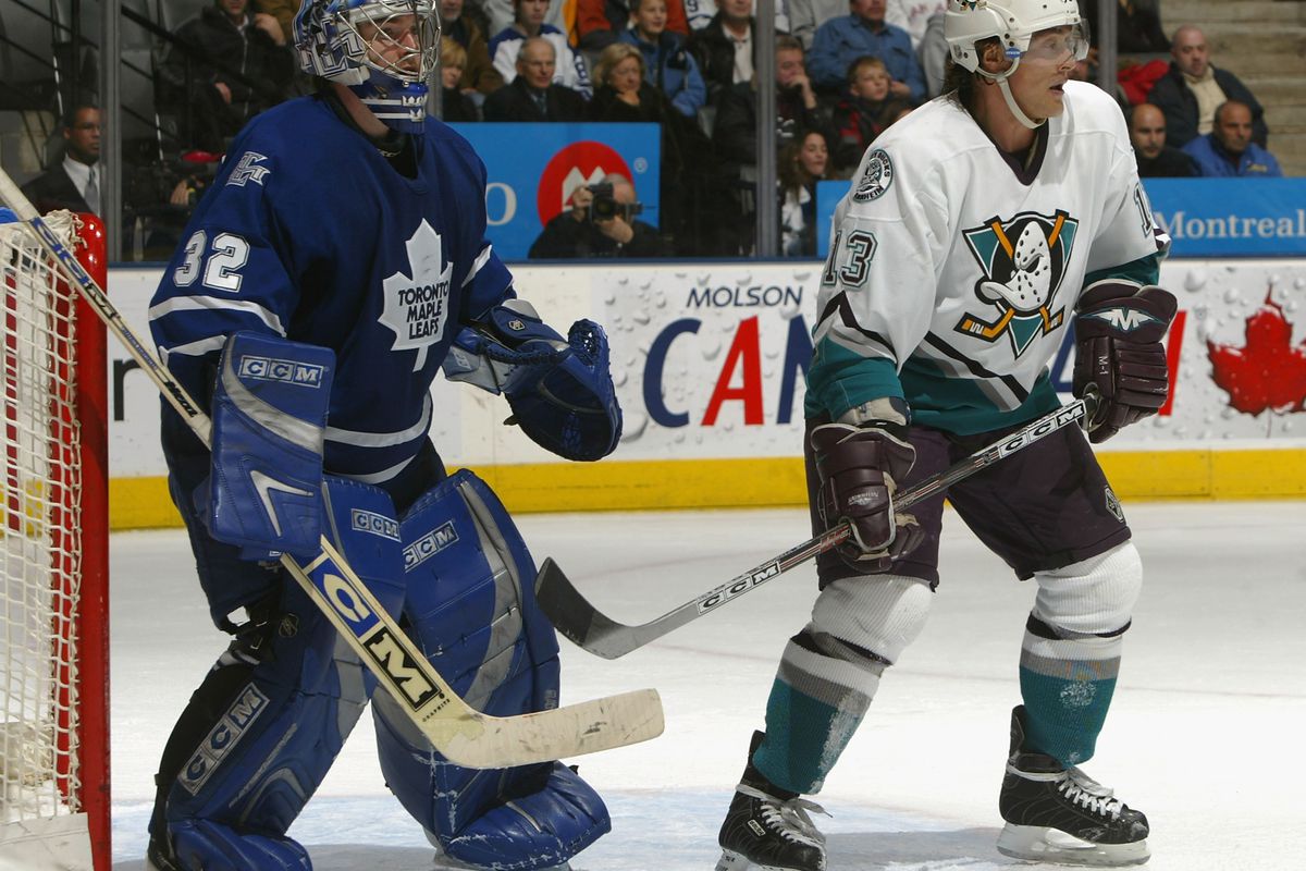 TORONTO - DECEMBER 12: Teemu Selanne #13 of the Mighty Ducks of Anaheim sets a screen near goaltender Mikael Tellqvist #32 of the Toronto Maple Leafs during the NHL game at the Air Canada Centre on December 12, 2005 in Toronto, Ontario, Canada. The L