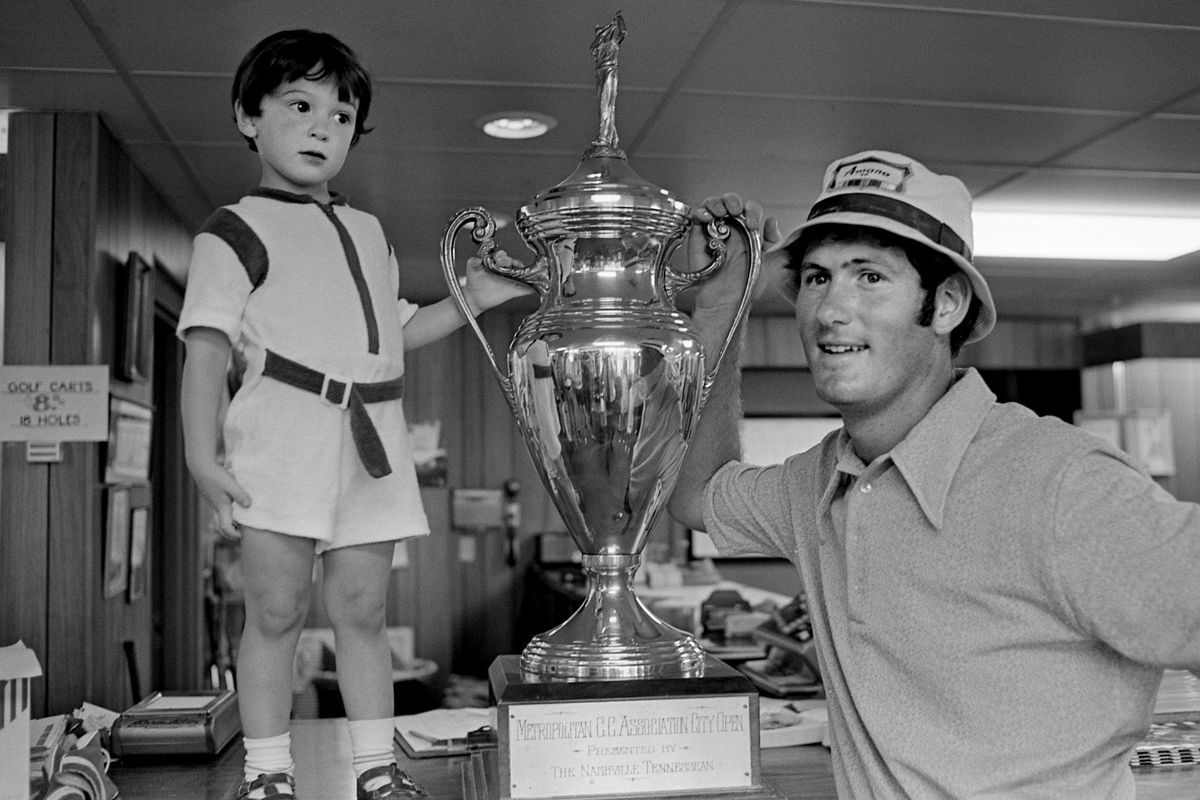 &nbsp;Ben Eller, 3-year-old son of the Metropolitan Open champion Richard, helps his father display the trophy that went along with the first-place finish in the tournament on his home course of Old Hickory June 12, 1971