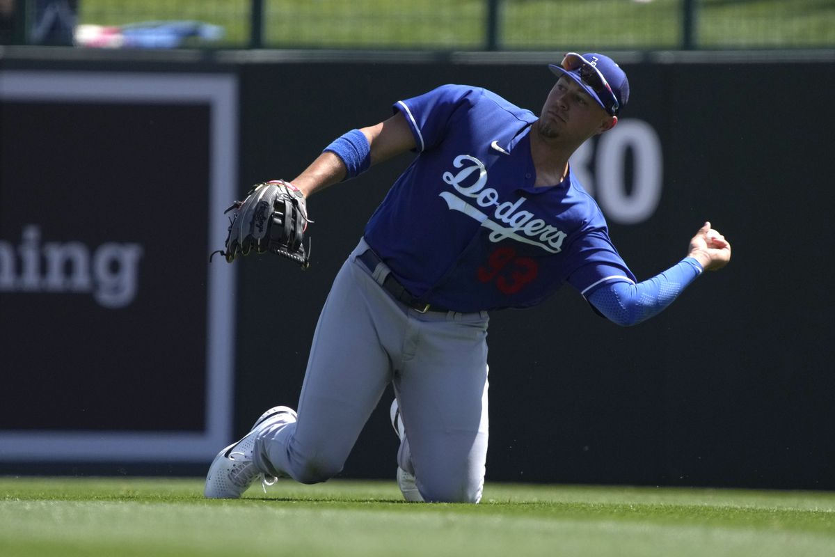 Mar 21, 2022; Phoenix, Arizona, USA; Los Angeles Dodgers right fielder Ryan Noda (93) dives for a ball in the second inning during a spring training game against the Chicago White Sox at Camelback Ranch-Glendale.