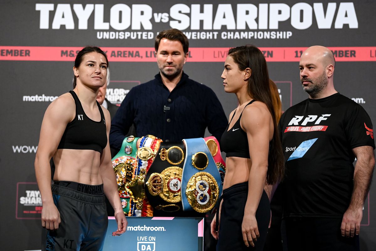 Katie Taylor, left, and Firuza Sharipova during weigh ins ahead of their Undisputed Lightweight Championship bout at The Black-E in Liverpool, England.