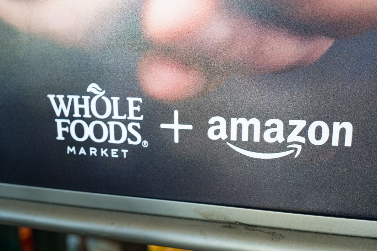 Signage advertising Amazon’s purchase of Whole Foods 