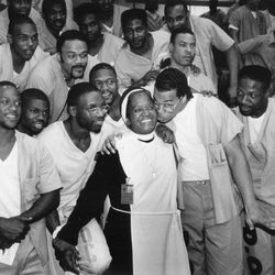 Inmates at the Cook County Jail celebrate the Rev. Consuella York’s 70th birthday in1993. Mother York preached to inmates at the County Jail.
