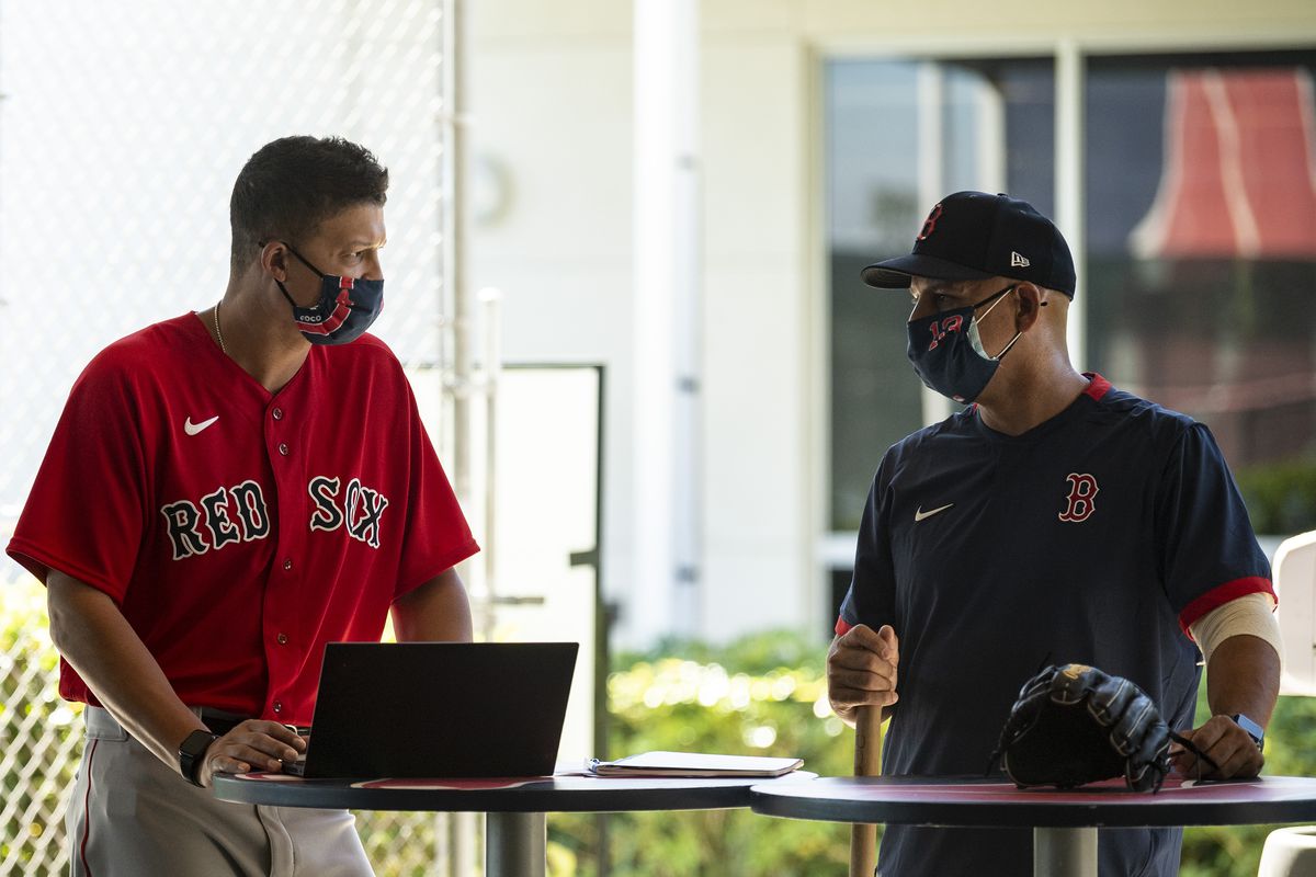 Alex Cora of the Red Sox using a laptop during spring training