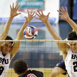 BYU's Tyler Heap (9) and BYU's Michael Hatch (23) go for a block attempt during a match against the Stanford Cardinal Friday, Jan. 24, 2014, at the Smith Fieldhouse in Provo.