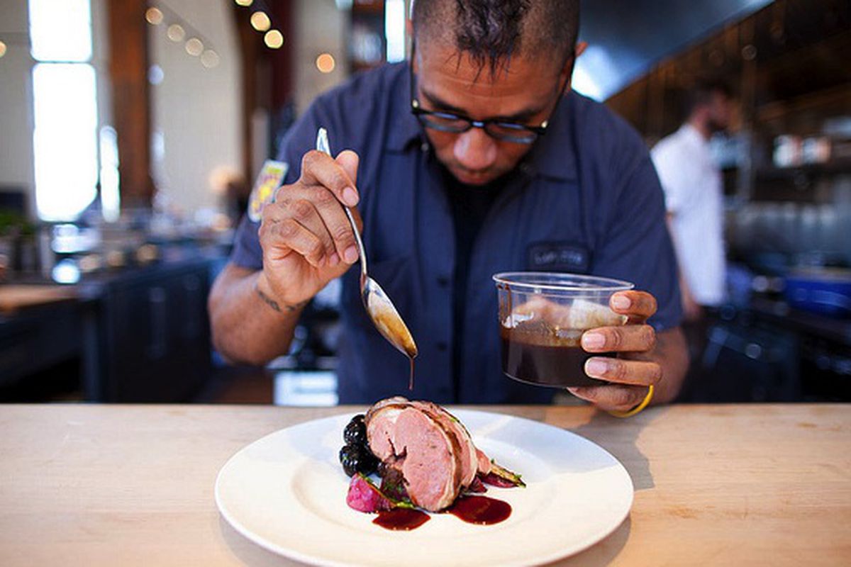 Chef Russell Jackson plating at Lafitte. 