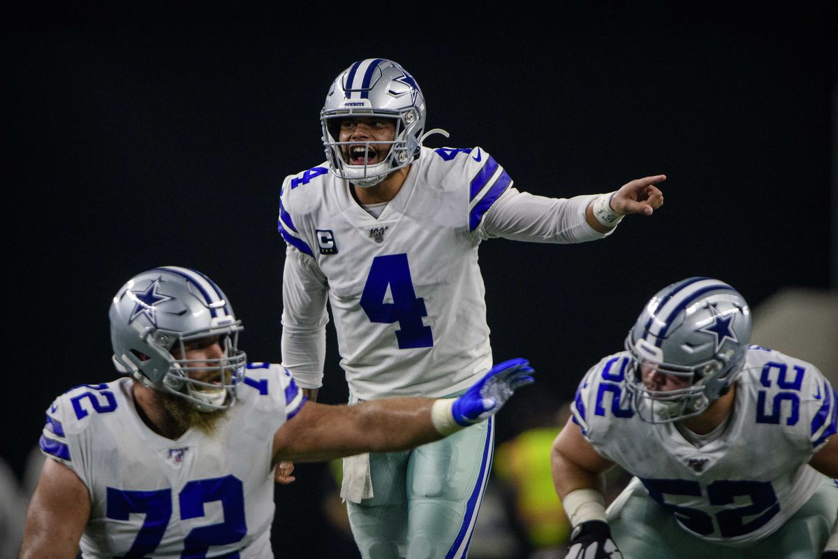 Dallas Cowboys center Travis Frederick, guard Connor Williams and quarterback Dak Prescott in action during the game between the Bills and Cowboys at AT&amp;T Stadium.