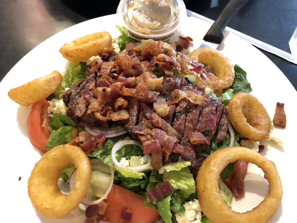 A salad at the Palace Grill can arrive framed with onion rings. | Neil Steinberg/Sun-Times