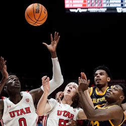 From left, Utah center Lahat Thioune, guard Gabe Madsen, California forward Andre Kelly and guard Jalen Celestine reach for a loose ball during an NCAA game at the Huntsman Center in Salt Lake City on Sunday, Dec. 5, 2021.
