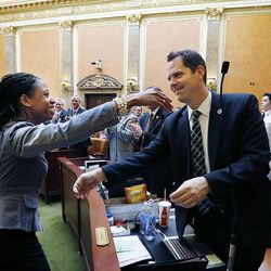 Rep. Mia Love, R-Utah, hugs Rep. Jacob Anderegg, R-Lehi, after addressing the Utah House of Representatives in Salt Lake City, Wednesday, Feb. 18, 2015. 
 