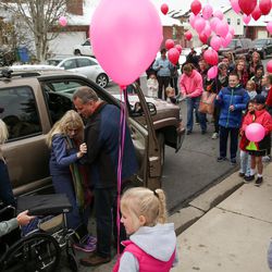 Chad Stilson helps his wife, Kim Power Stilson, into a wheelchair as they arrive at their home in Orem on Saturday, Dec. 3, 2016.