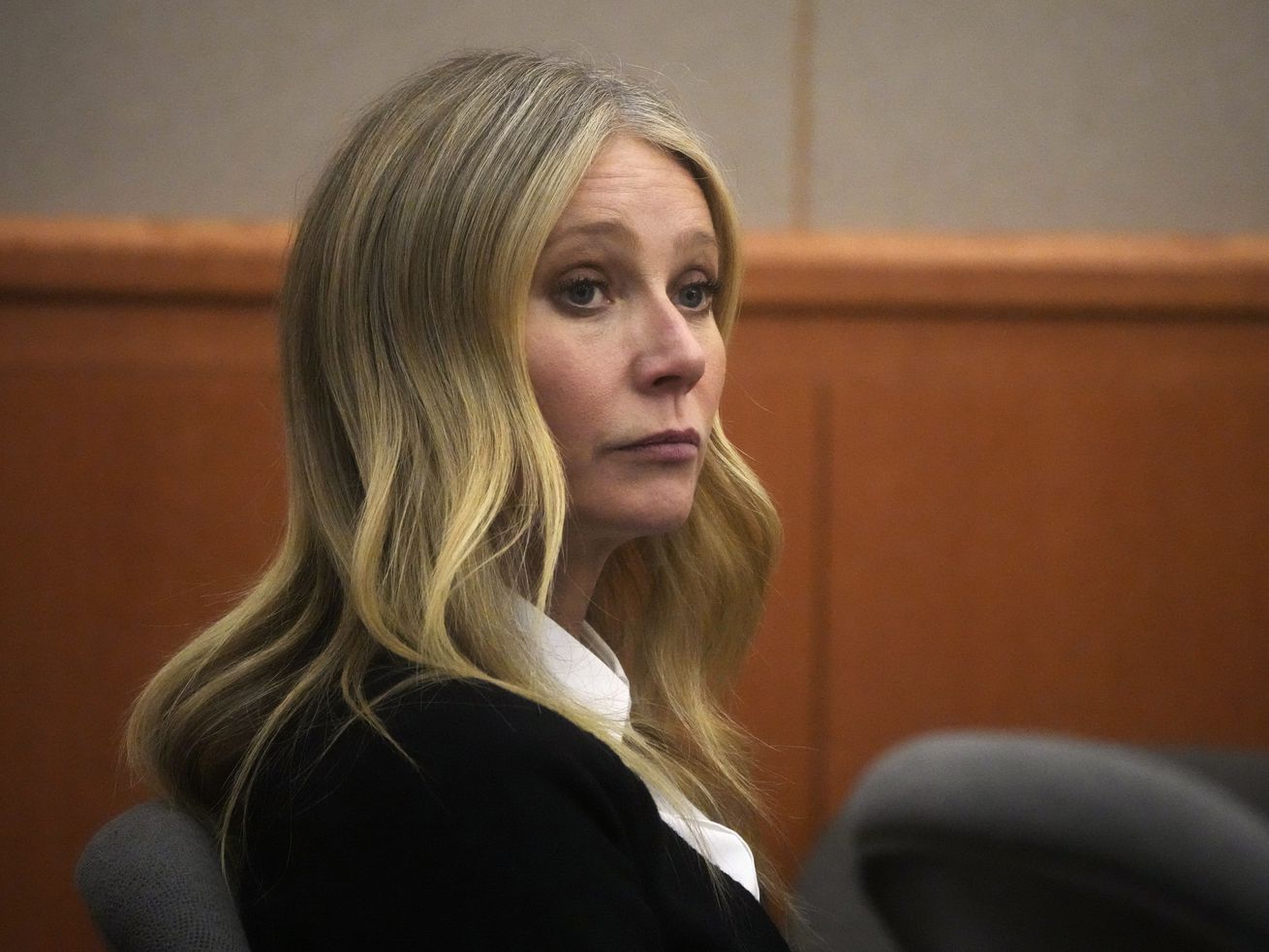 Actress Gwyneth Paltrow siting in a courtroom.