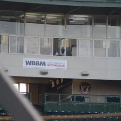 6:41 p.m. The new radio station banner on the press box - 
