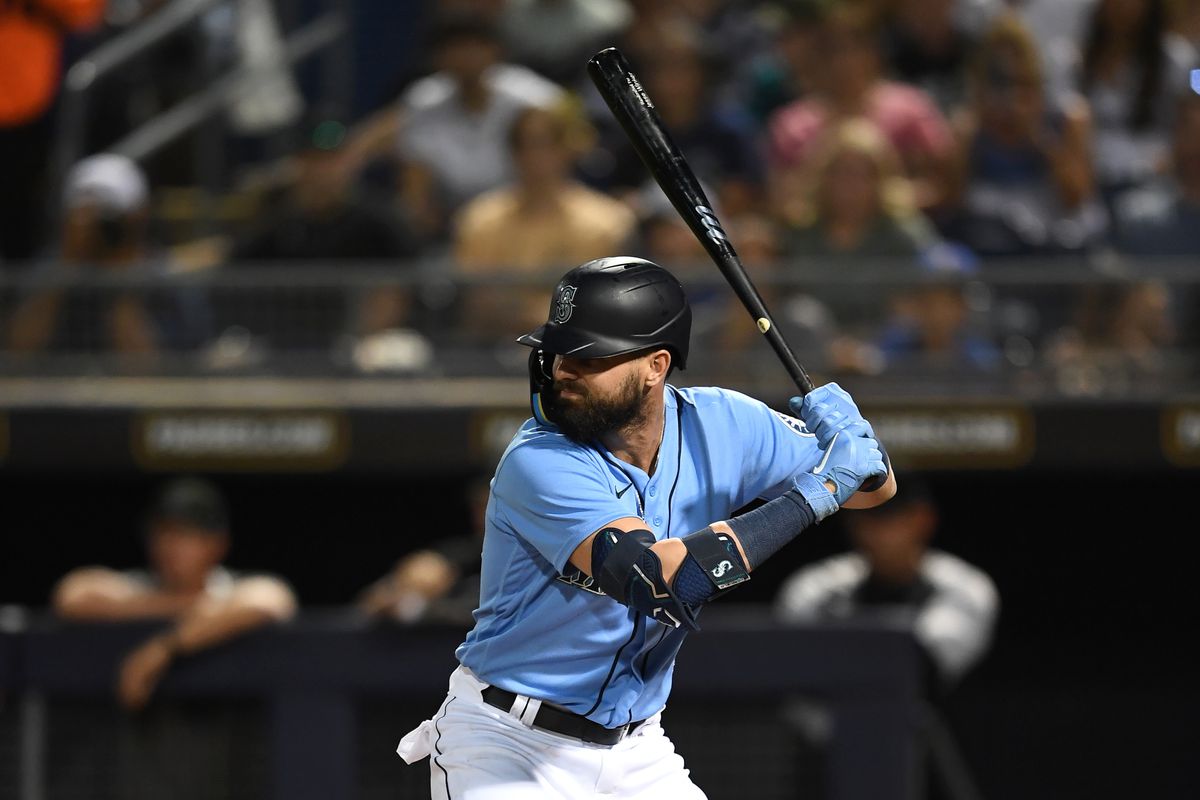 Jesse Winker #27 of the Seattle Mariners bats during the first inning of an MLB spring training game against the Chicago White Sox at Peoria Stadium on March 25, 2022 in Peoria, Arizona.