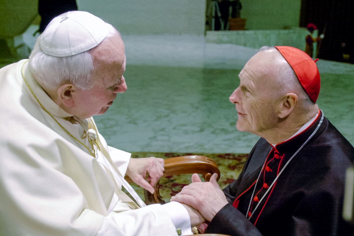 In this Feb. 23, 2001 file photo, U.S. Cardinal Theodore Edgar McCarrick, archbishop of Washington, D.C., shakes hands with Pope John Paul II