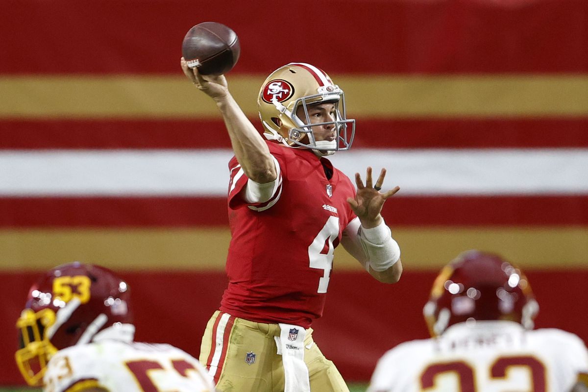 Quarterback Nick Mullens #4 of the San Francisco 49ers delivers a pass against the defense of the Washington Football Team in the second quarter of the game at State Farm Stadium on December 13, 2020 in Glendale, Arizona.
