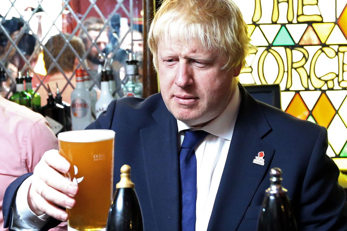 Boris Johnson stares at a pint of beer in a pub