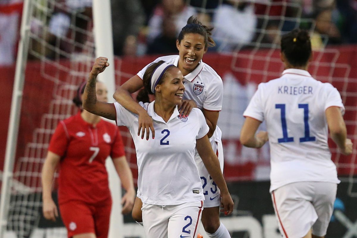 Sydney Leroux (2) celebrates her tying goal in last night's match as Carli Lloyd and Ali Krieger thank her for choosing the USA over, y'know, Canada.