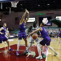 Utah Valley Wolverines center Akolda Manyang is fouled by Casey Benson of Grand Canyon during the Western Athletic Conference basketball tournament in Las Vegas on Friday, March 9, 2018.