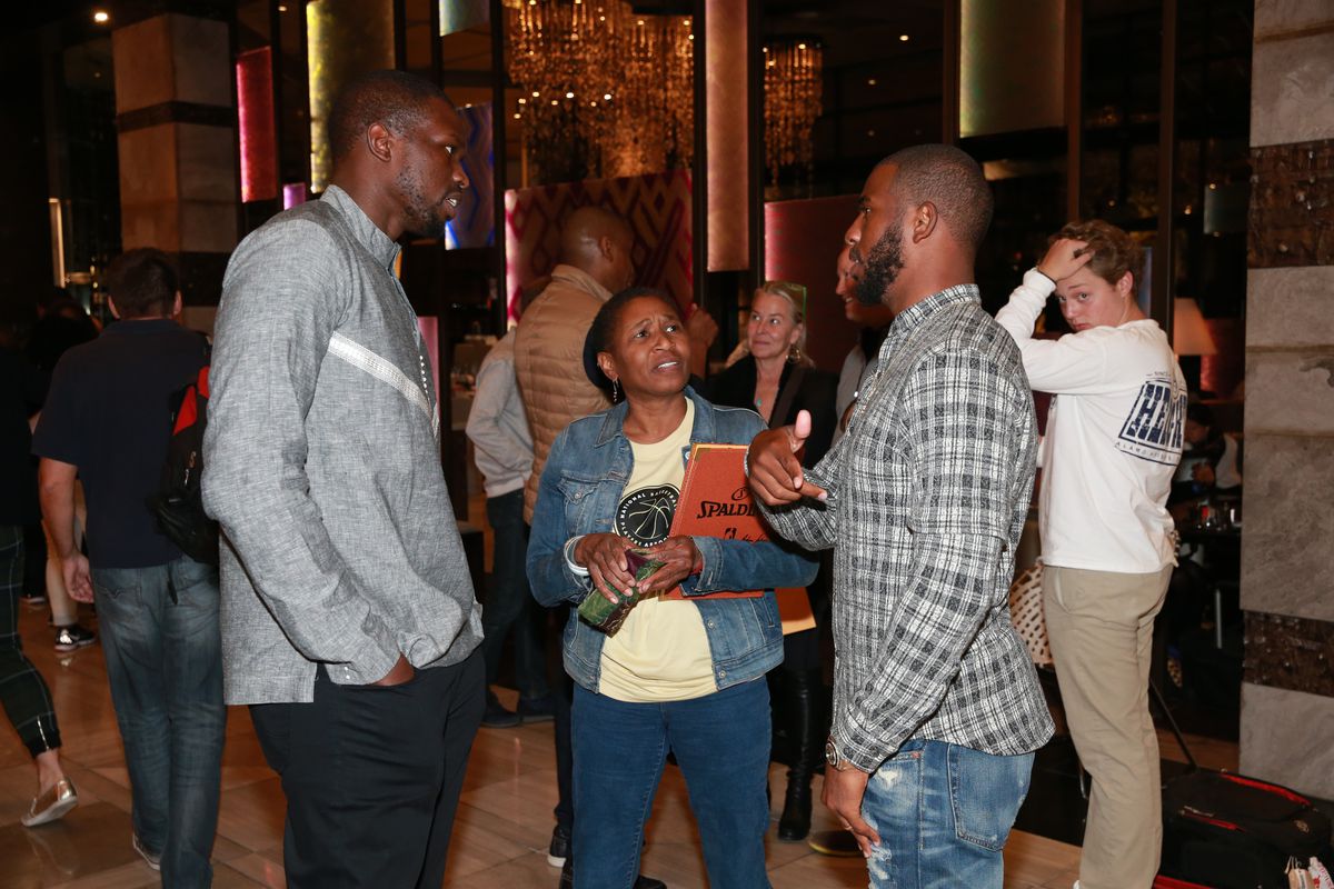 Luol Deng of the Miami Heat and Chris Paul of the Los Angeles Clippers greets Michele Roberts, Executive Director of the NBPA as they arrive for the Basketball Without Boarders program on July 28, 2015 at the Hyatt Regency Hotel in Johannesburg, South Africa.&nbsp;