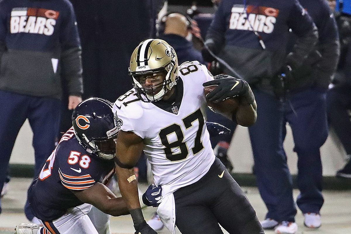 Jared Cook #87 of the New Orleans Saints breaks away from Roquan Smith #58 of the Chicago Bears after a catch at Soldier Field on November 01, 2020 in Chicago, Illinois. The Saints defeated the Bears 26-23 in overtime.