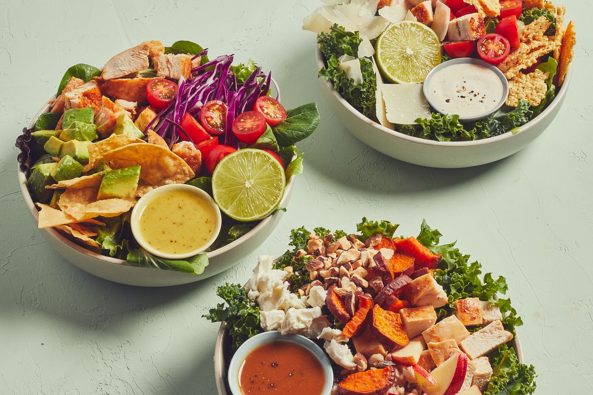 A trio of salads from Sweetgreen served in white bowls