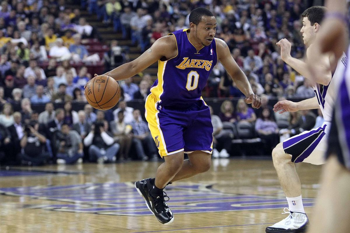 April 26, 2012; Sacramento, CA, USA; Los Angeles Lakers guard Andrew Goudelock (0) drives in against the Sacramento Kings during the second quarter at Power Balance Pavilion. Mandatory Credit: Kelley L Cox-US PRESSWIRE