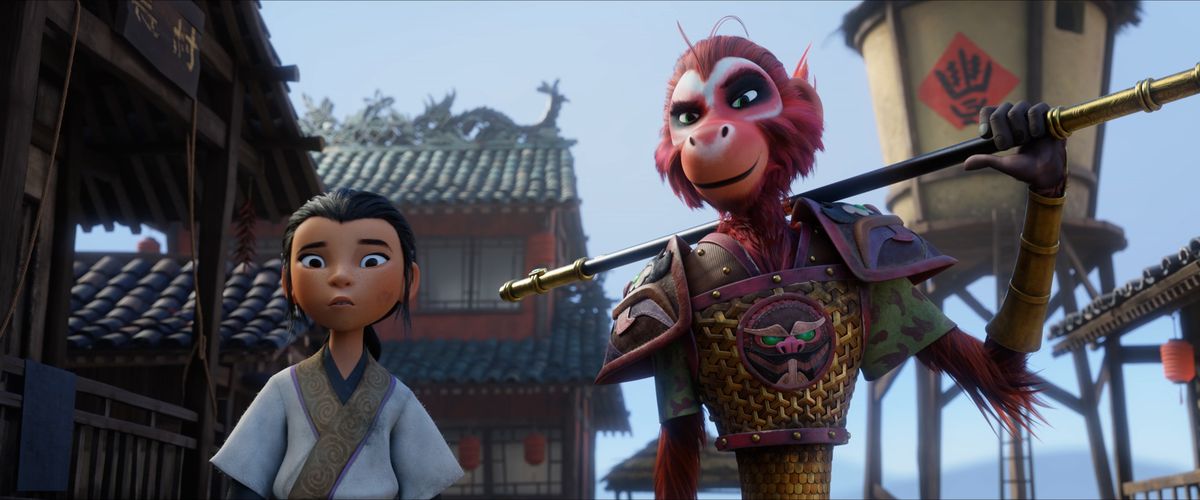 A young, dark-haired child in a white kimono looks concerned at something offscreen as the Monkey King, a pink-furred monkey in a golden vest, shoulders a metal-tipped staff and smirks