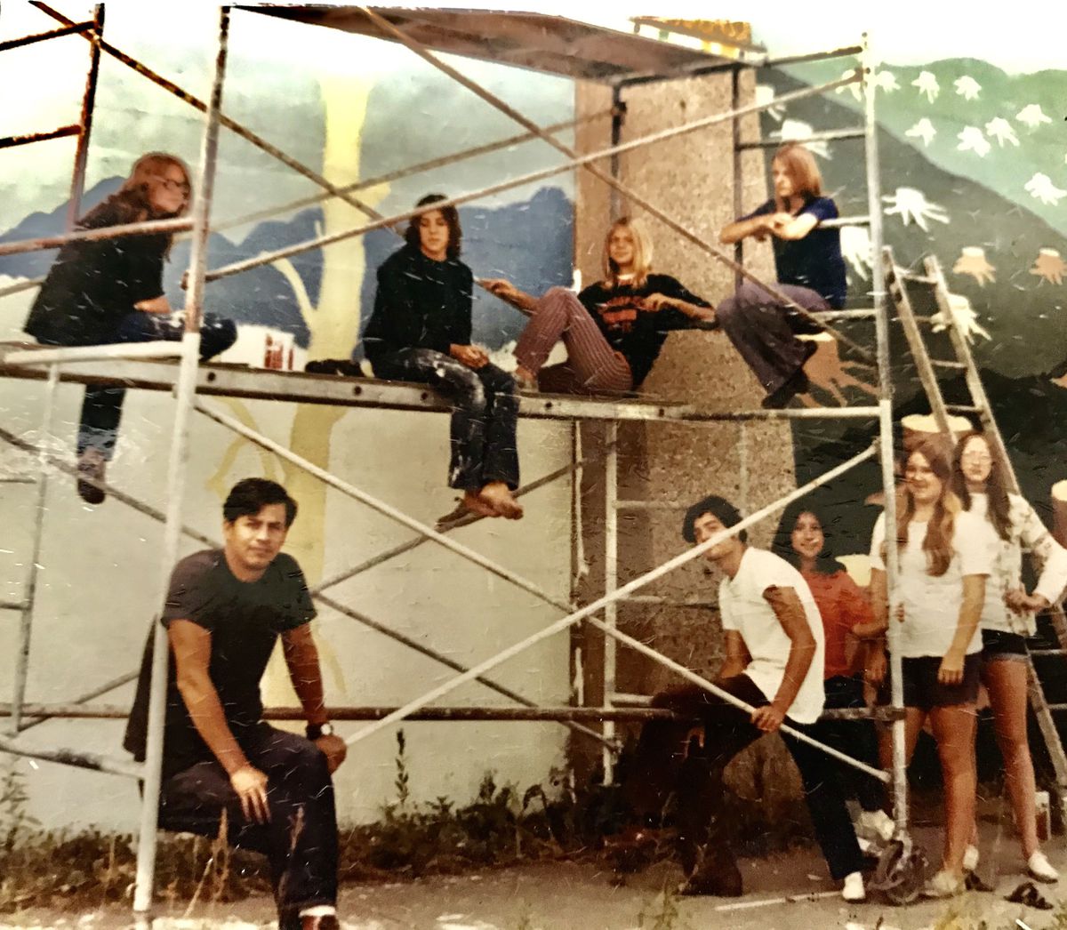 Artist Ricardo Alonzo and some of his students working on the Hubbard Street murals in the 1970s.