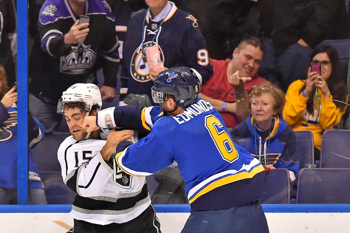 Which is funnier - the Kings player getting pummeled by Joel, or the Kings fan that has to get a pic of it?